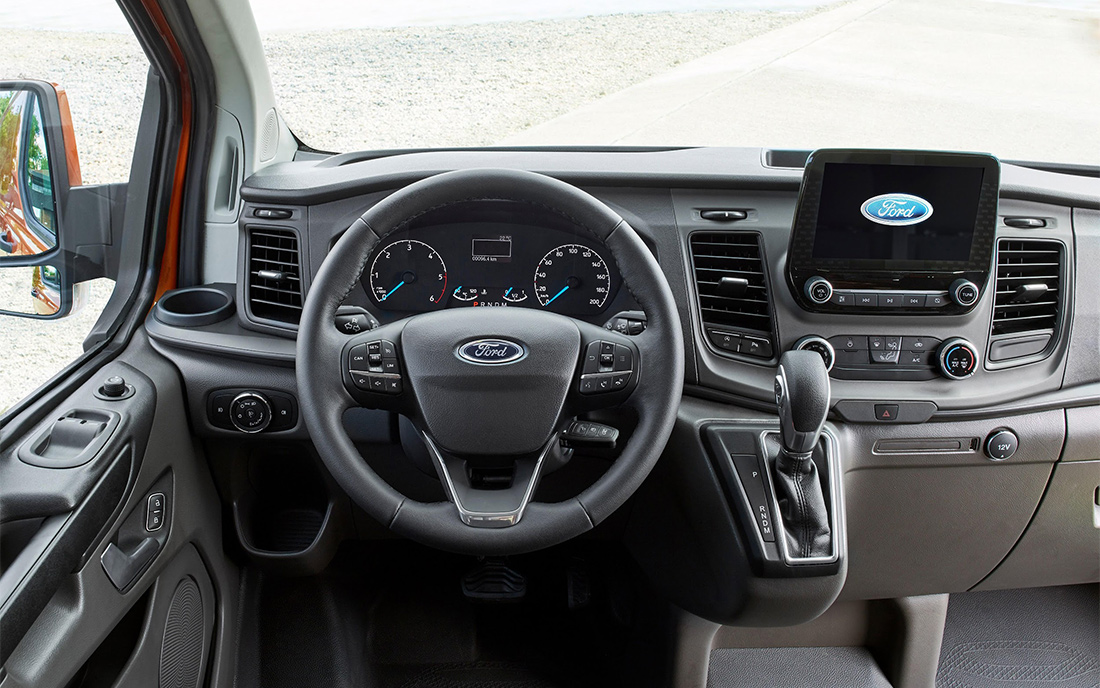 Passengers seated inside a luxury van